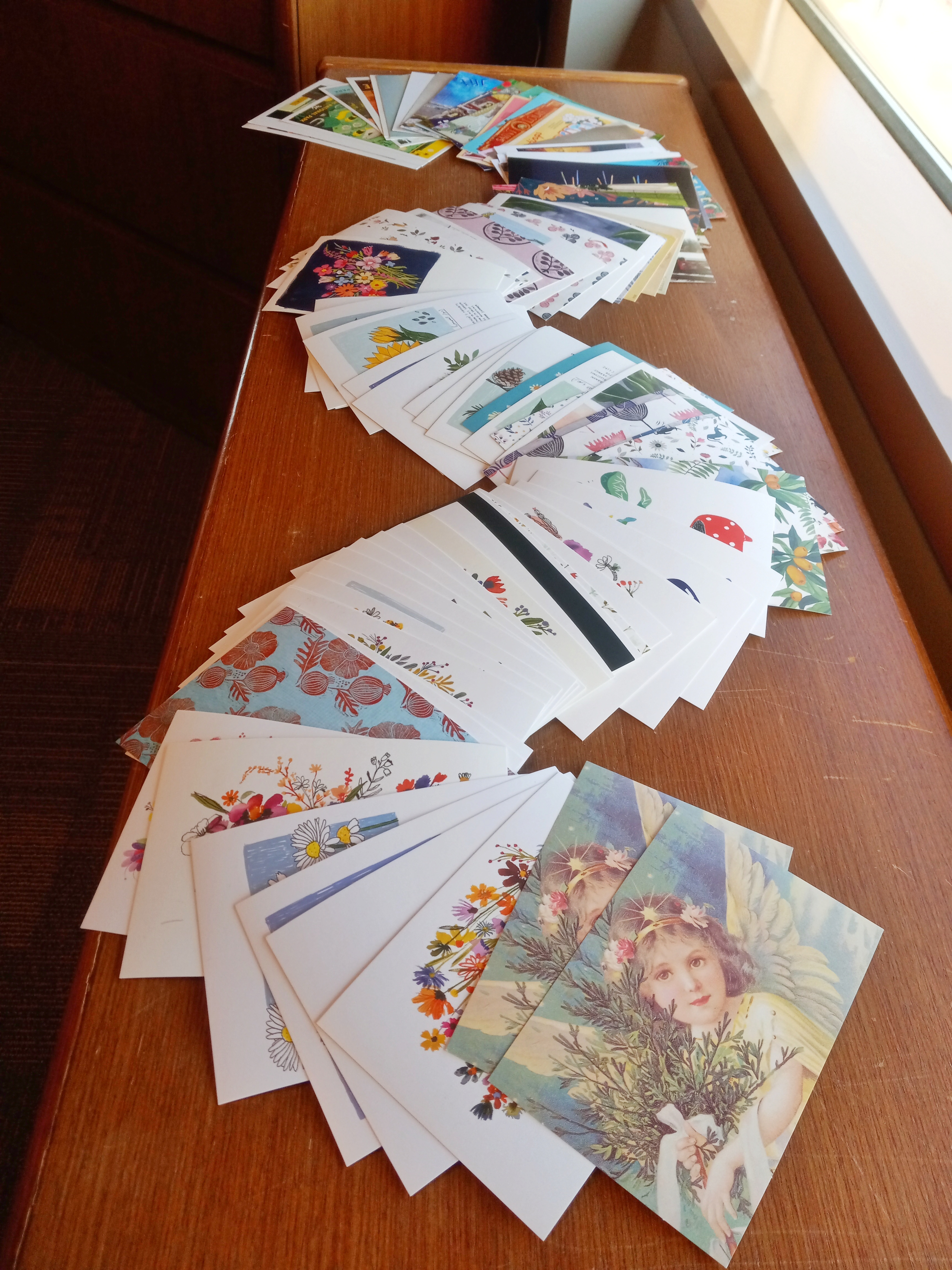 101 Postcards spread out on a table